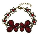 Pulseira dourado envelhecido com pedras vermelhas